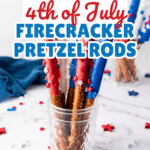 Easy firecracker pretzel rods decorated in red, white, and blue candy coating with star sprinkles, displayed in a glass jar on a marble surface, with overlay text that reads “How to Make 4th of July Firecracker Pretzel Rods” for a fun patriotic dessert recipe.