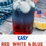 A clear glass filled with a layered red white and blue patriotic punch sits on a rustic wooden table, with bright red liquid at the bottom, a deep blue middle layer, and ice floating on top creating a frosty white effect. A metal straw is placed in the glass, and small American flags decorate the drink and the surrounding area. A lemon wedge rests nearby, along with a blue textured cloth and scattered ice cubes, creating a festive 4th of July setting. Overlay text on the image reads “Easy Red White & Blue Drink” and a banner at the bottom says “Visit thisnanacancook.com for the full recipe.”